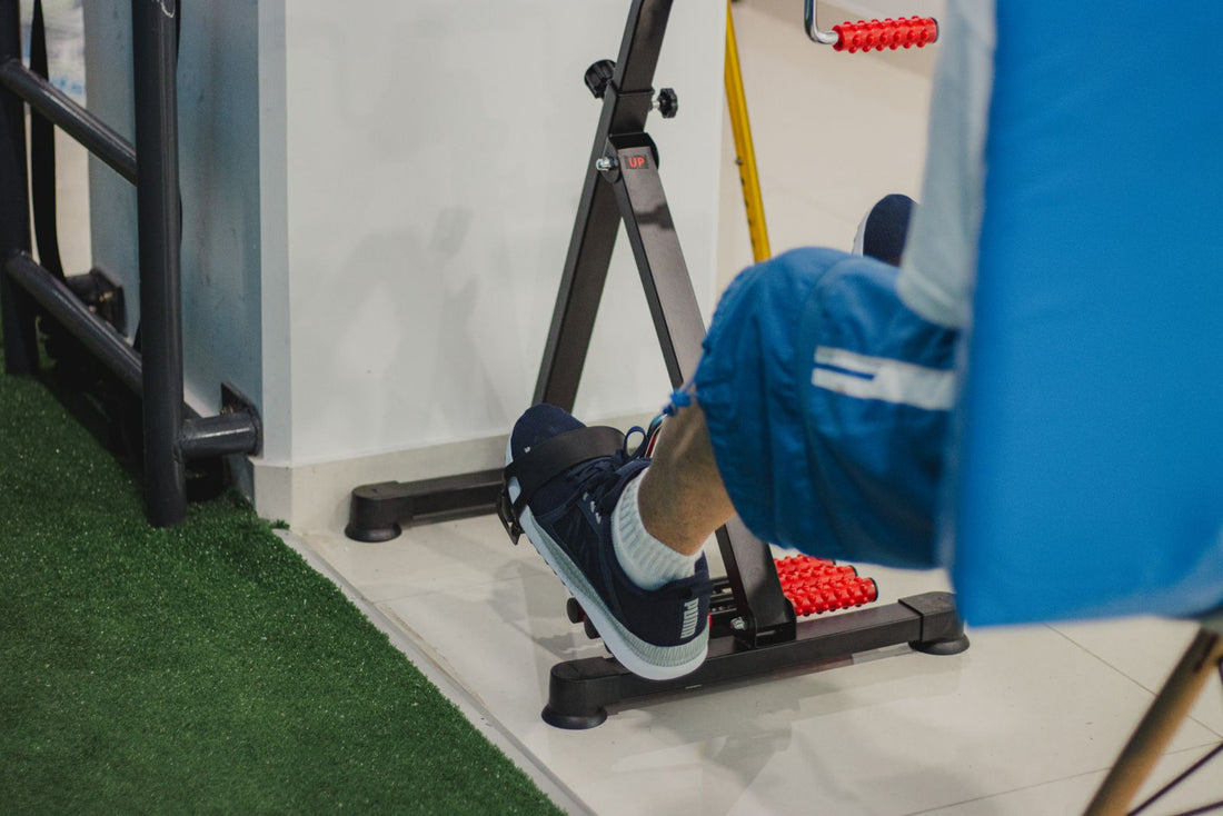 Close-up of a person training on a stationary bike indoors, comparing spin bikes and exercise bikes in South Africa