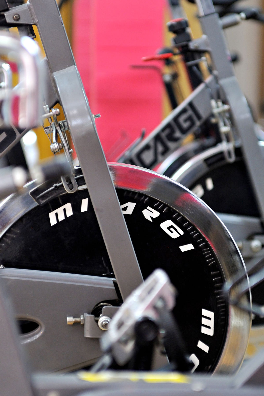 Row of indoor spinning bikes in a fitness studio, illustrating spinning bikes available in South Africa