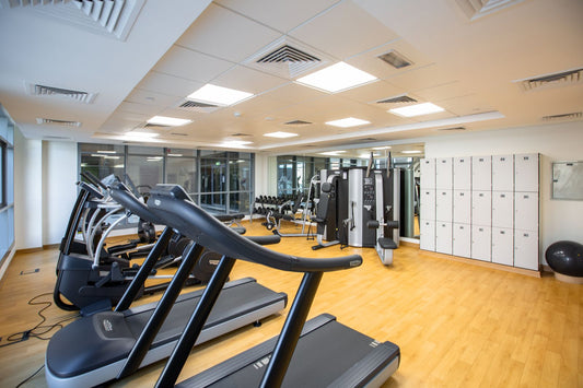 Spacious gym interior with treadmills and fitness machines, illustrating commercial treadmill choices for South African gyms, hotels and estates