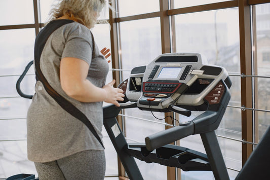 Woman running on a home treadmill in South Africa, illustrating how to choose the best treadmill for home use