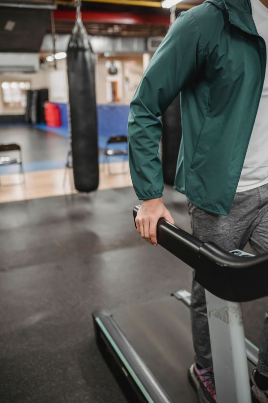 Person jogging on an entry-level home treadmill, illustrating budget treadmill options in South Africa