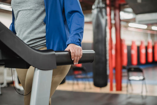 Woman training on a treadmill in a modern fitness centre, illustrating whether smart treadmills are worth it in South Africa
