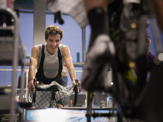 Cyclist training hard on an indoor bike, illustrating Zwift-compatible equipment available in South Africa